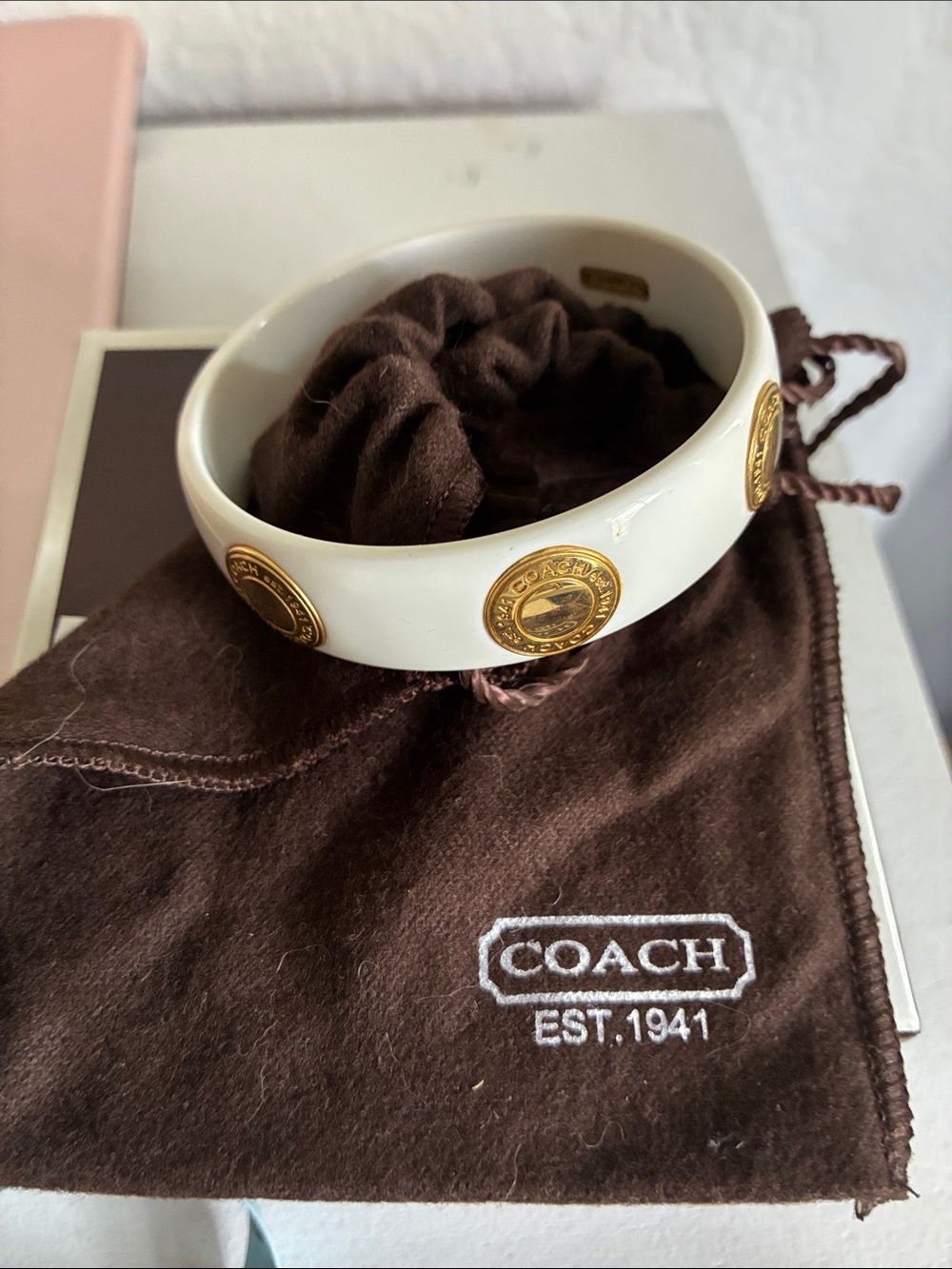 Coach White Bangle with Gold Logo Medallions